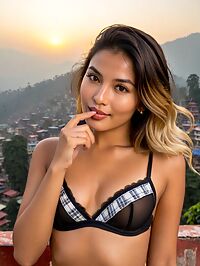 Romanian woman in black lingerie near sunrise over Kathmandu's rooftops